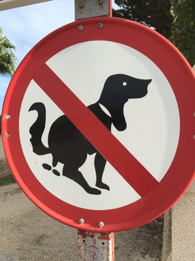 Pooping dog sign