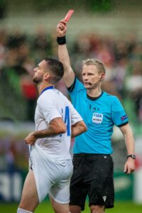 Referee showing a red card