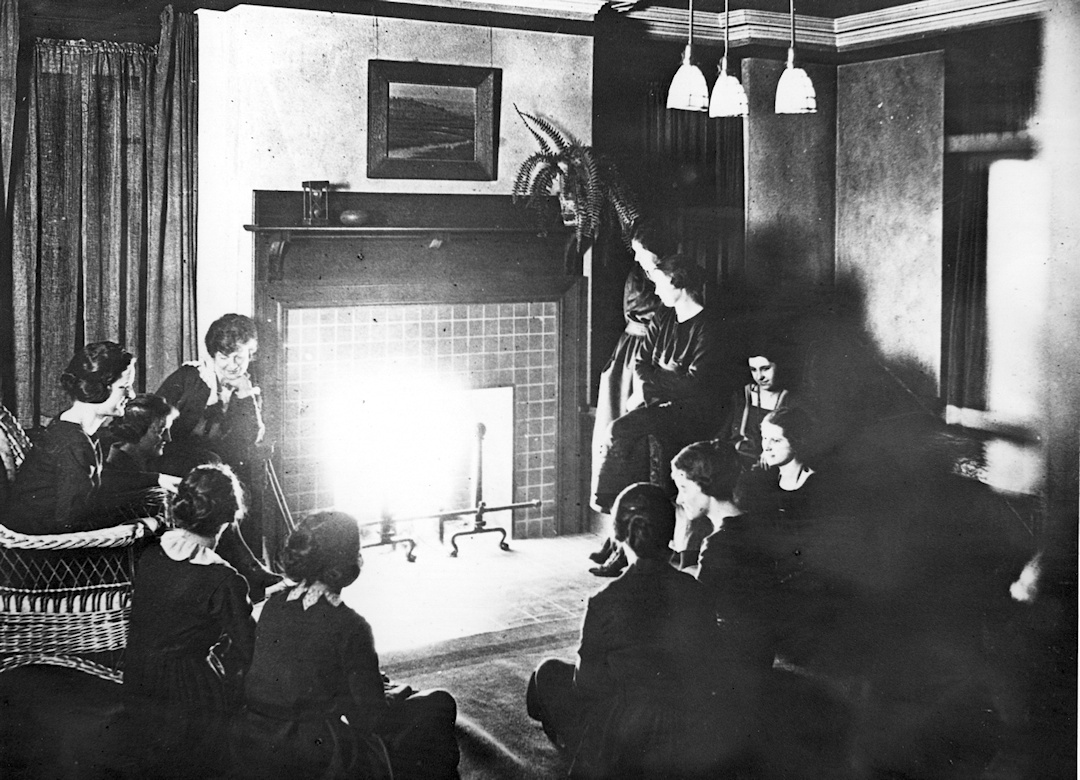 Practice apartment boarders next to a fireplace at Cornell University